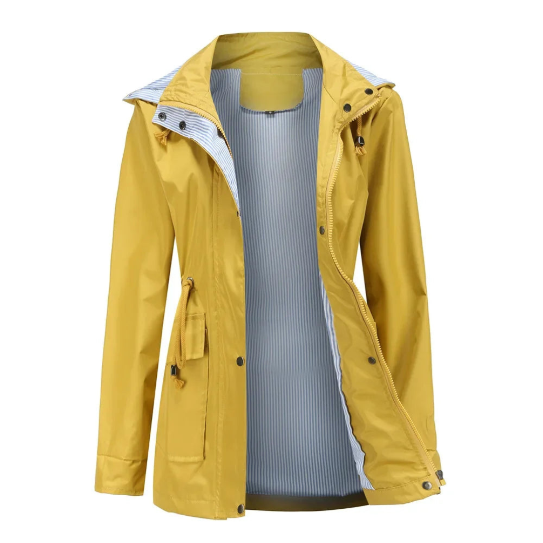 Woman walking confidently in a chic waterproof trench coat, highlighting its versatile design for everyday wear.