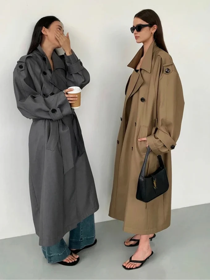Elegant women's oversized long trench coat in a flowing classic style, perfect winter outerwear for sophisticated fall fashion.