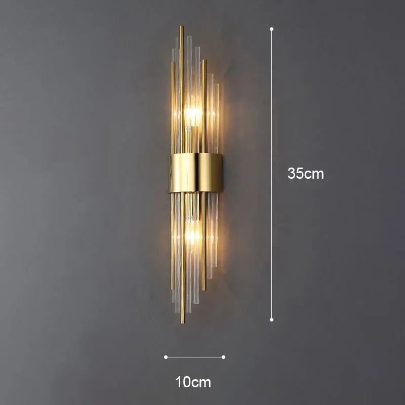 Bright LED wall sconce for living rooms. Elegant gold finish, modern design, & crystal highlights.