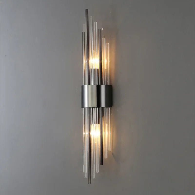 Designer LED wall sconce. Elegant crystal glass and gold finish create a luxurious ambiance in any room.