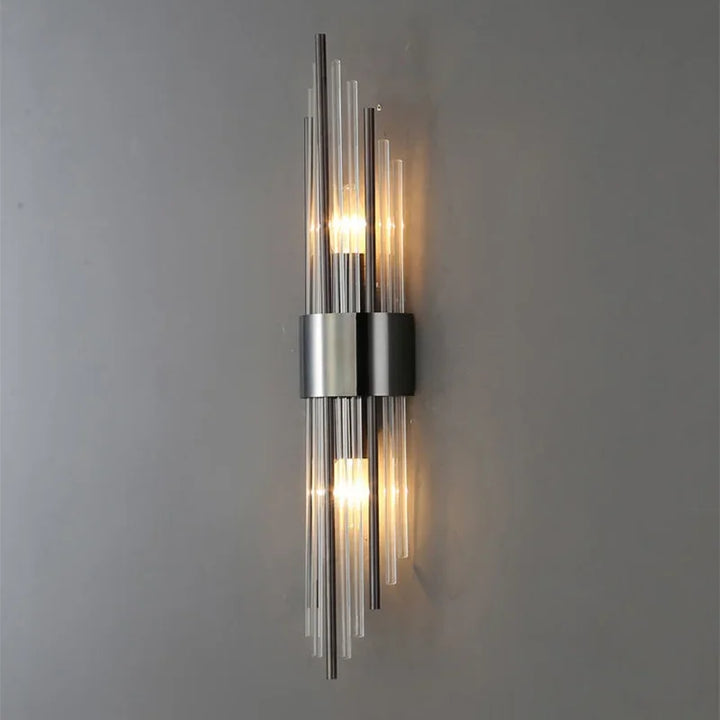 Designer LED wall sconce. Elegant crystal glass and gold finish create a luxurious ambiance in any room.