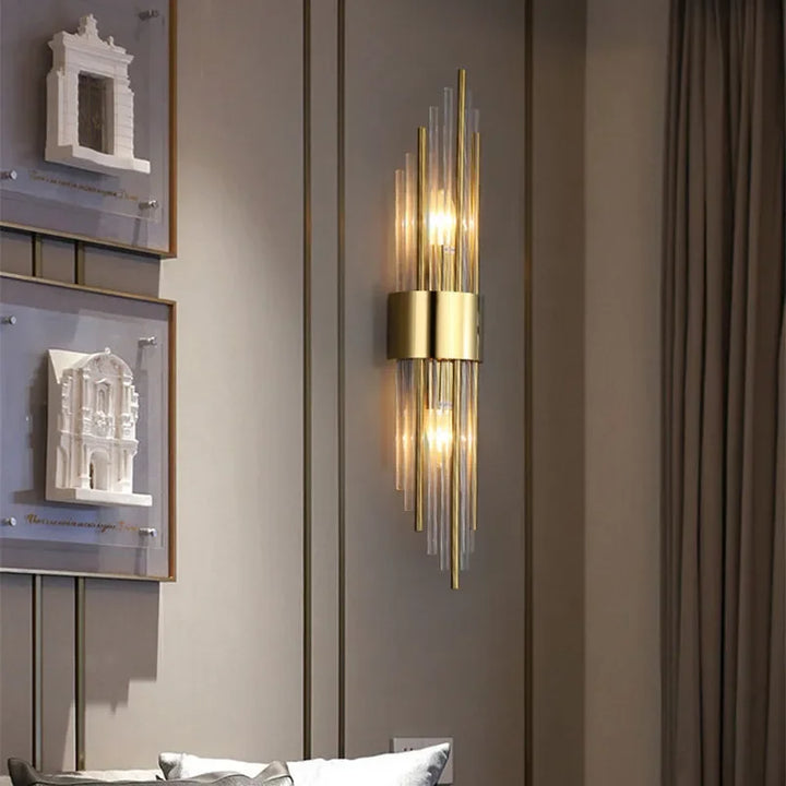 Regal LED wall sconce, elegant crystal glass, gold finish. Modern indoor accent light for home decor.