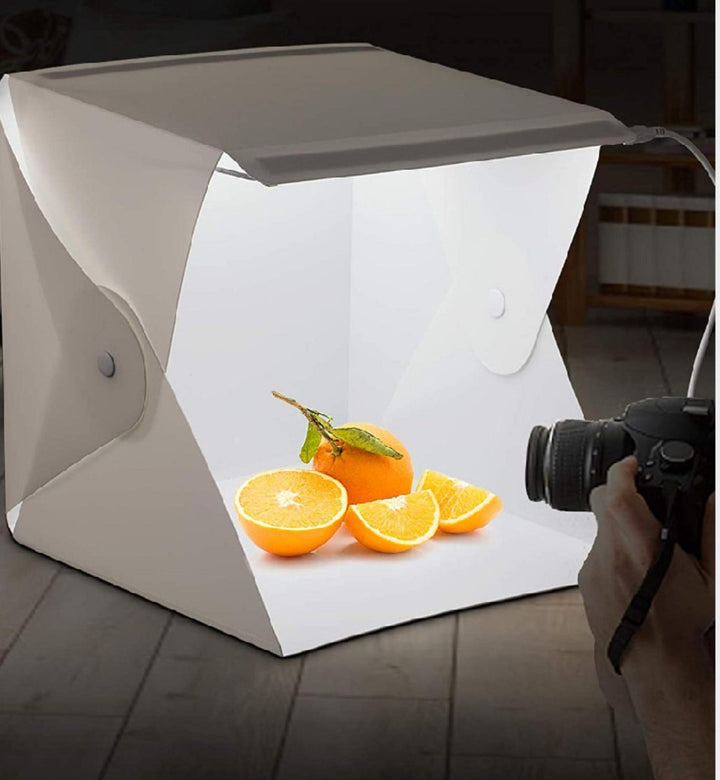Portable LED light box studio for professional product photography, ideal for ecommerce items & small objects.