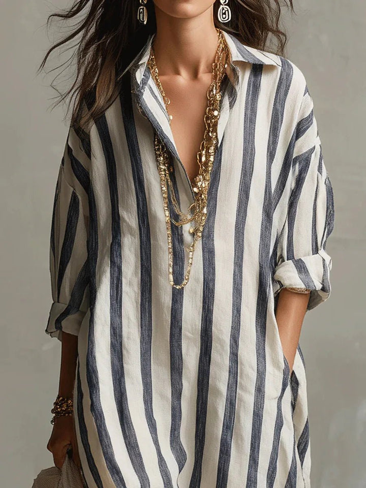 Stylish striped maxi dress for women, featuring a relaxed fit, practical pockets, and elegant collar.