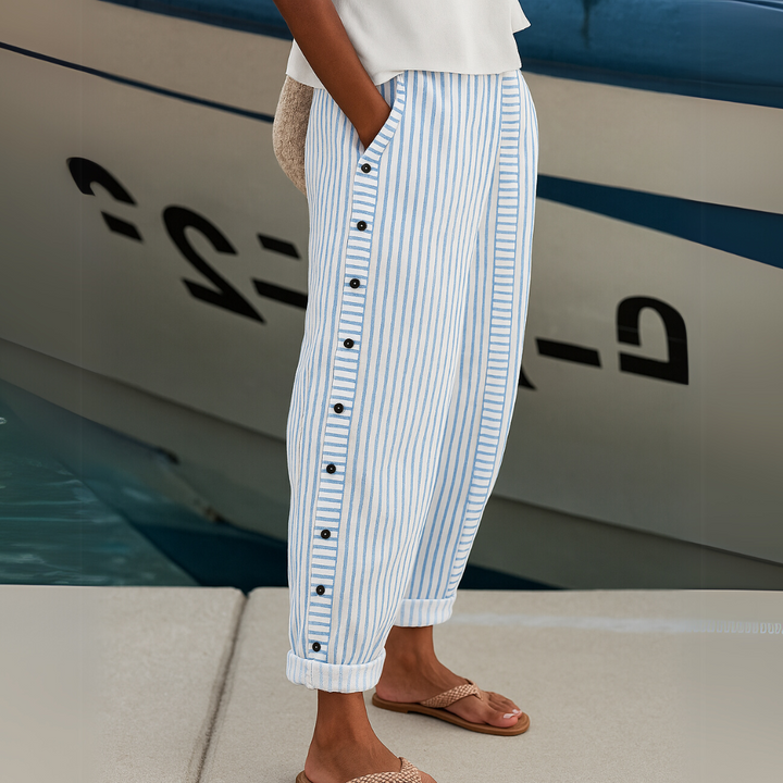 Chic striped wide-leg women's trousers with button detail. High-waisted and comfortable for versatile everyday wear.
