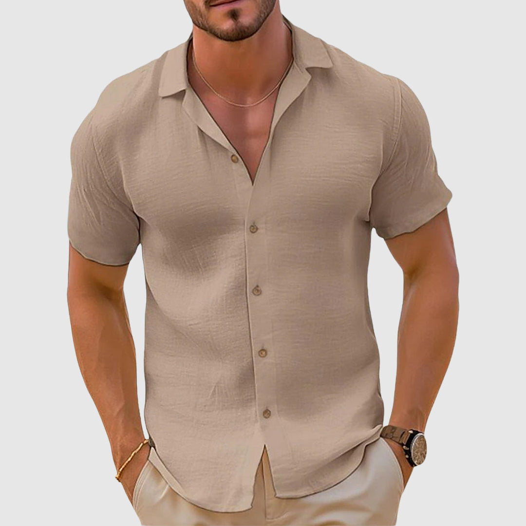 White men's relaxed fit polo, ideal for summer fashion, comfortable & versatile everyday wear.