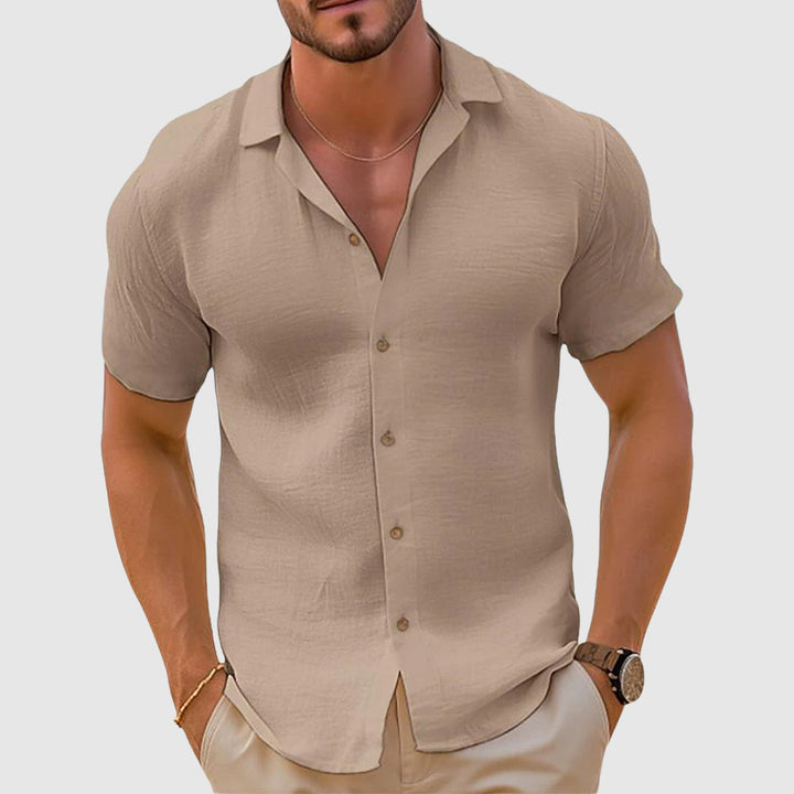 White men's relaxed fit polo, ideal for summer fashion, comfortable & versatile everyday wear.