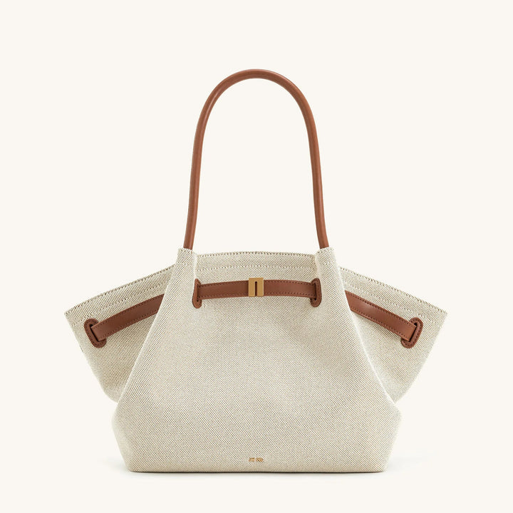 Interior view of a women's luxury shoulder bag, showcasing its large capacity and practical design.
