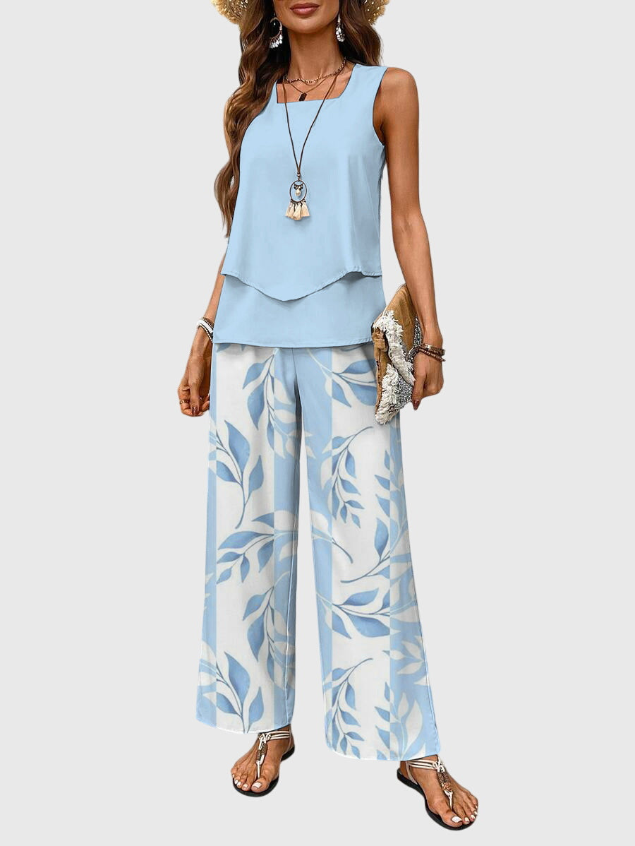 Elegant women's floral two-piece set, perfect for summer vacations. Breathable fabric & relaxed fit.