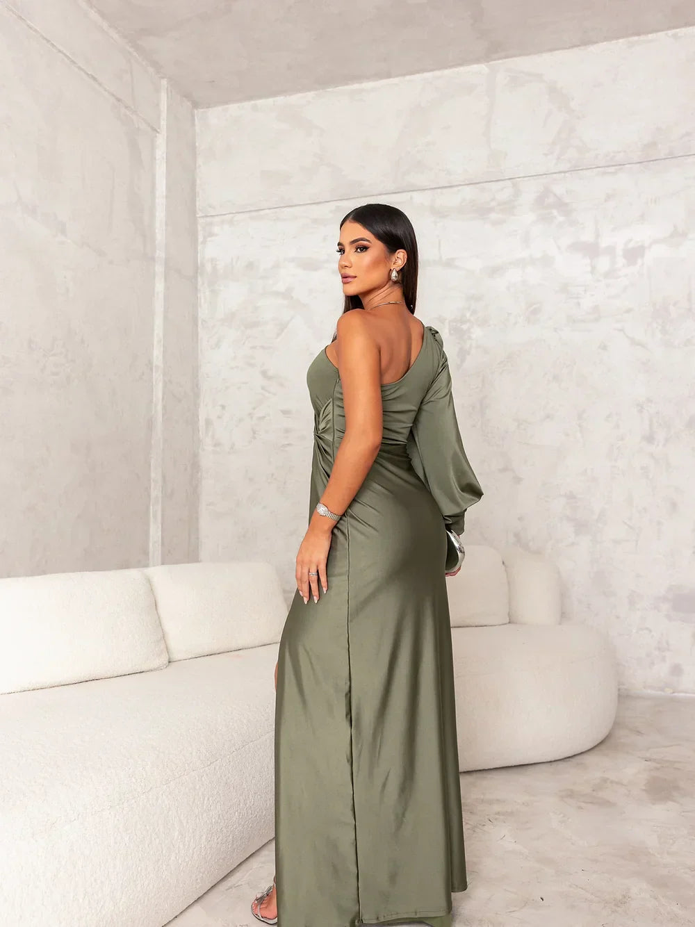 Stylish women's black one-shoulder maxi dress with elegant draping, ideal for evening parties.