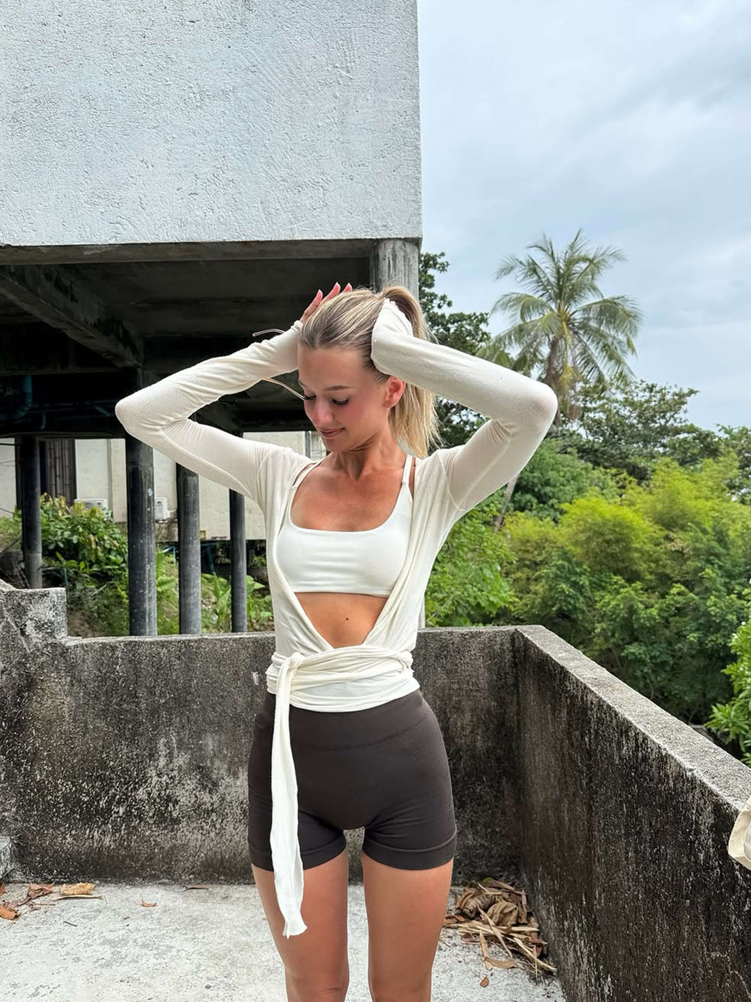 Women's lightweight activewear: wrap front V-neck long sleeve top, essential for Pilates & comfortable lounging.