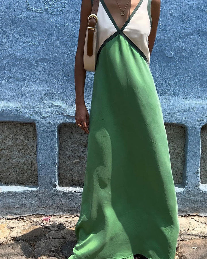 Close-up of the V-neck on a women's elegant color block maxi dress, perfect for day or evening wear.