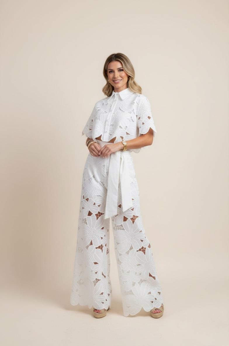 Chic women's floral wide-leg pants & embroidered top set. Resort wear, casual elegant outfit.