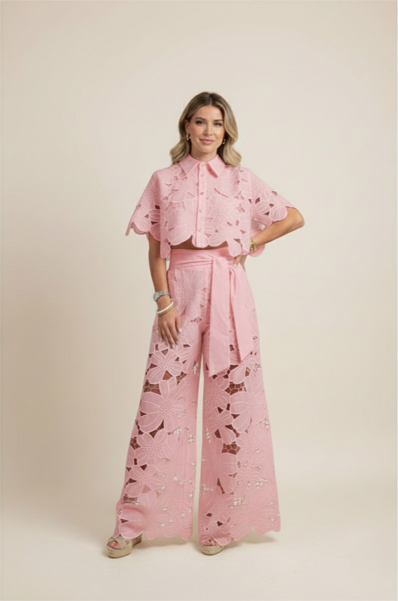 Women's spring floral ensemble: embroidered top, wide-leg pants. Chic elegant summer style.