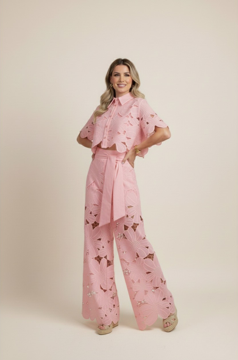 Stylish women's two-piece floral set with intricate embroidery and flowing wide-leg pants.