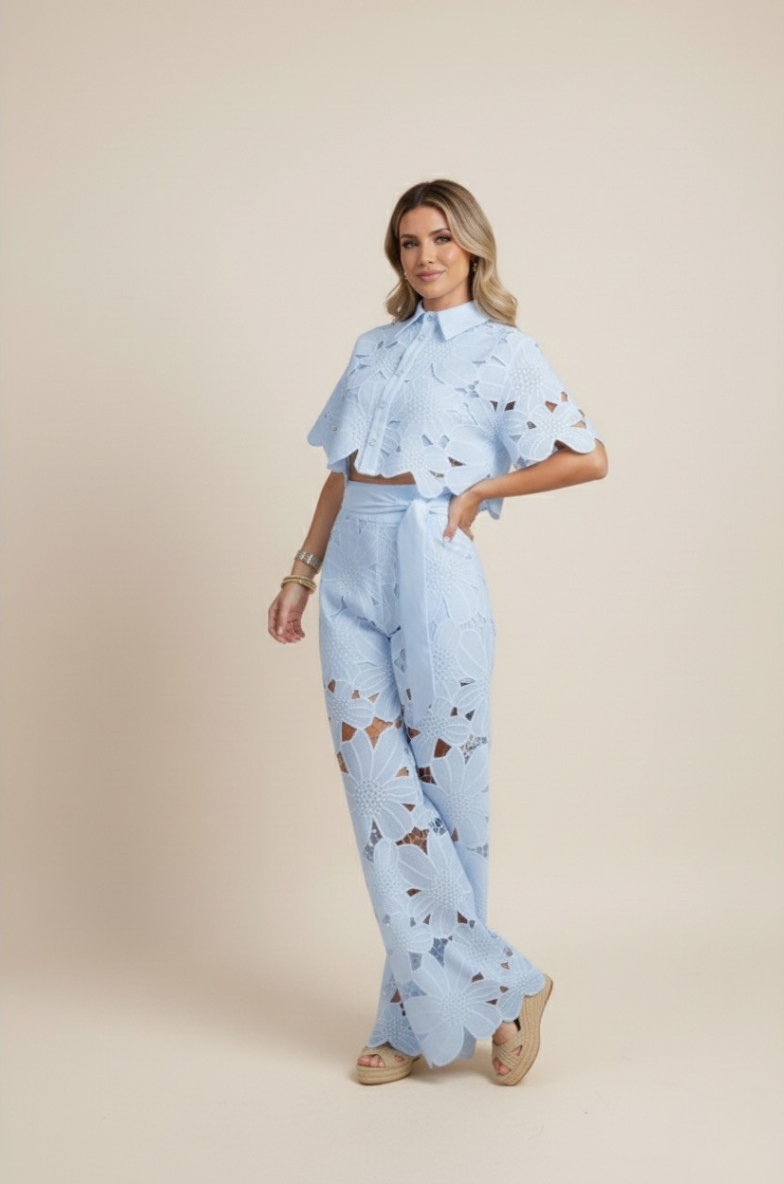 Statement women's floral two-piece set. Embroidered top & wide-leg pants, perfect for elegant events.