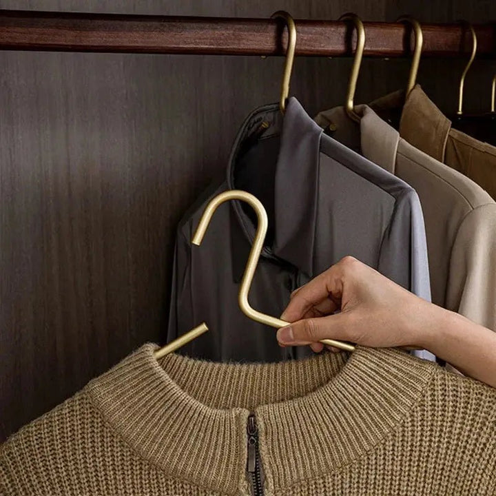 Close-up of non-slip metal hanger featuring strong grip, perfect for securing clothes. Essential for luxury wardrobe organization.
