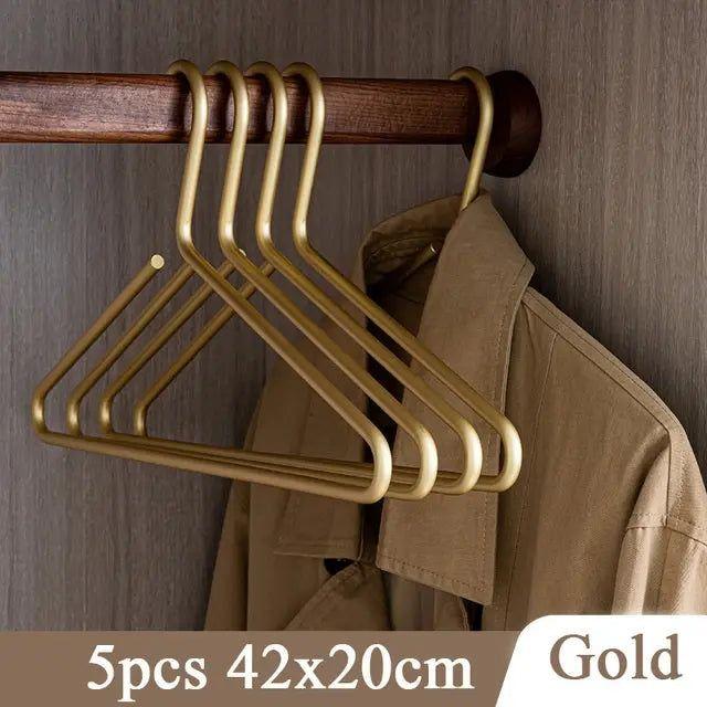 High-end gold metal hangers, adding luxury to your closet. Non-slip feature ensures secure, organized clothes storage. Closet refresh.