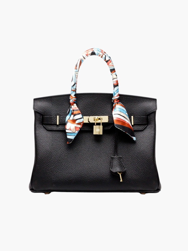 Elegant black leather handbag, a timeless fashion accessory for women with a secure closure.