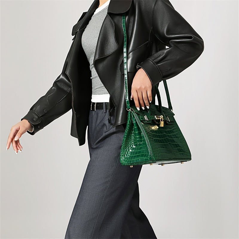 Stylish women's leather purse with a structured silhouette and secure elegant metallic clasp.