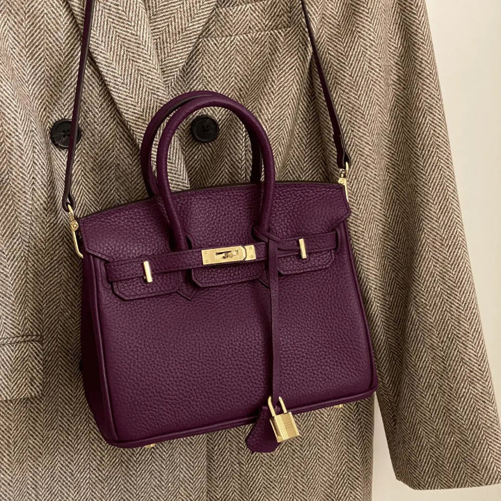 Sophisticated ladies' leather shoulder bag, featuring a stylish flap and secure elegant clasp.