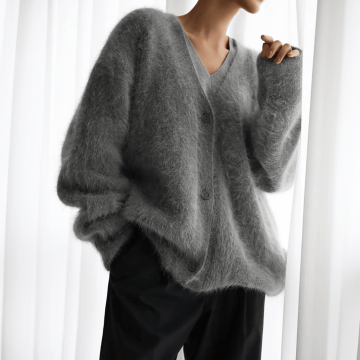 Casual women's fluffy cardigan, a versatile layering piece for effortless, everyday comfort & style.