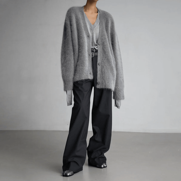 Elegant women's fluffy cardigan, designed for a relaxed fit and ultimate soft comfort. Winter style.