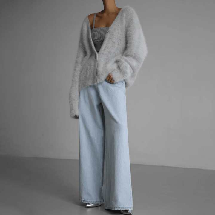 Effortless comfort meets style in this women's fluffy cardigan. A soft, cozy layering piece.