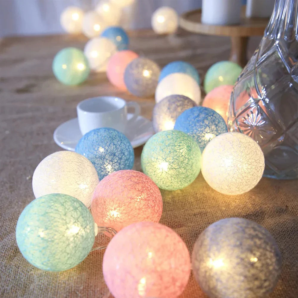 White cotton ball LED garland, timeless home decor for a serene and inviting atmosphere.