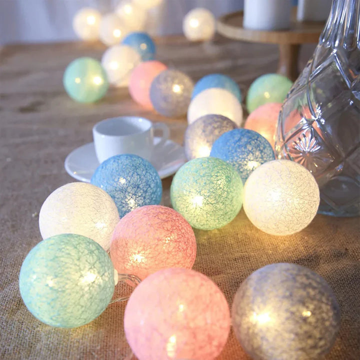 White cotton ball LED garland, timeless home decor for a serene and inviting atmosphere.