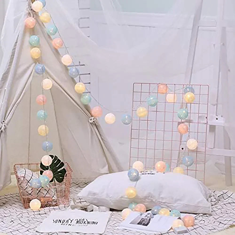 Flexible cotton ball LED string, easy to shape for unique decorative lighting arrangements.