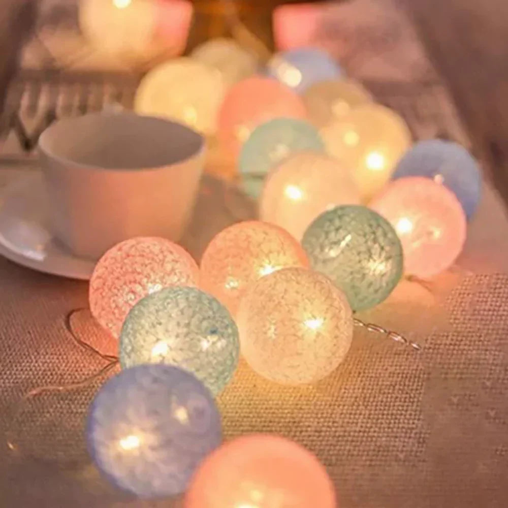Cozy cotton ball LED string lights, perfect for creating warm room ambiance & home decor.