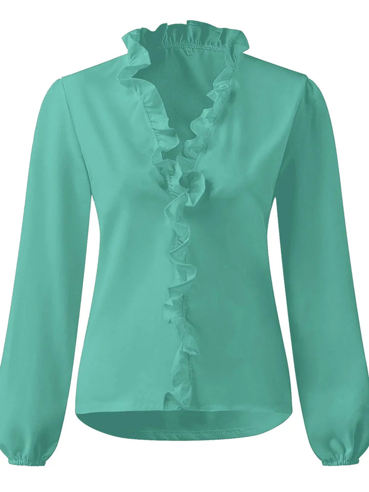 Elegant women's long sleeve blouse featuring a V-neck and charming ruffles. A versatile top for office or casual styling.
