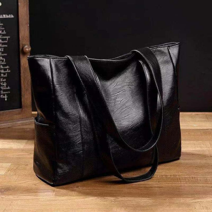 Women's large vintage brown leather tote bag, a classic shoulder handbag perfect for work & everyday use.