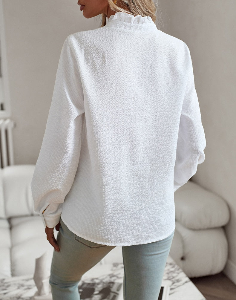 Sophisticated women's ruffled polo blouse, perfect for professional work wear or a formal ensemble.