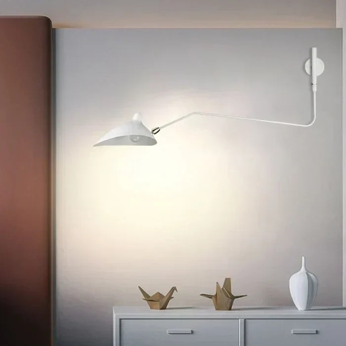 Adjustable black wall lamp for comfortable reading & chic accent lighting in modern homes.