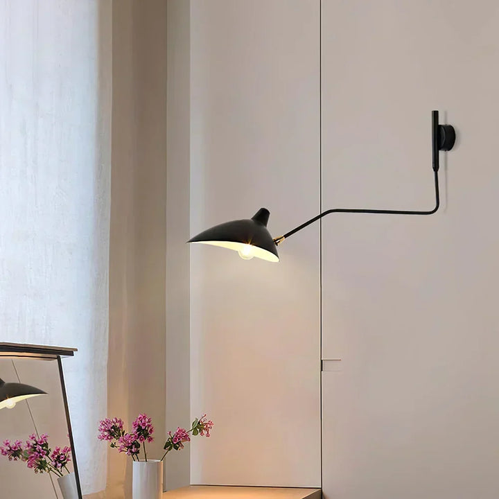 Sleek white adjustable wall lamp, perfect for focused reading light & modern Scandinavian interiors.