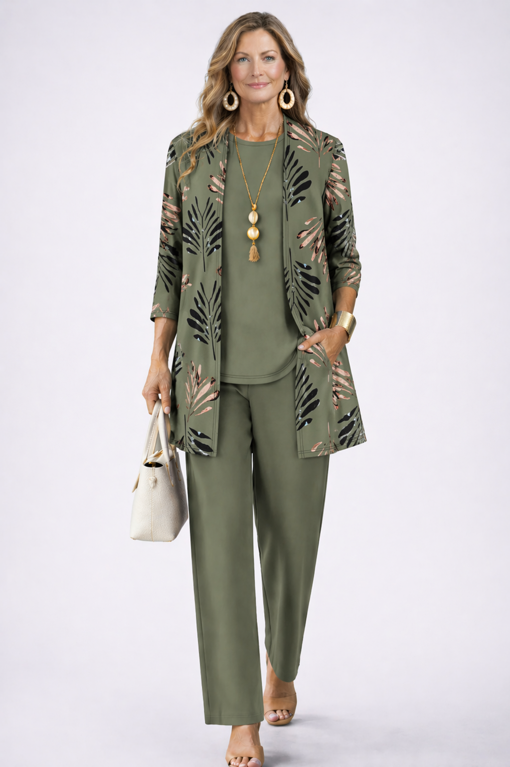 Women's stylish printed three-piece set: longline jacket, sleeveless top & relaxed fit pants. Versatile casual chic.