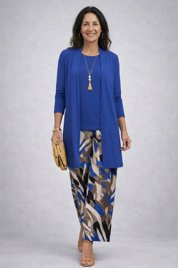Close-up of vibrant print detail on women's three-piece set; soft fabric for comfortable, stylish wear.