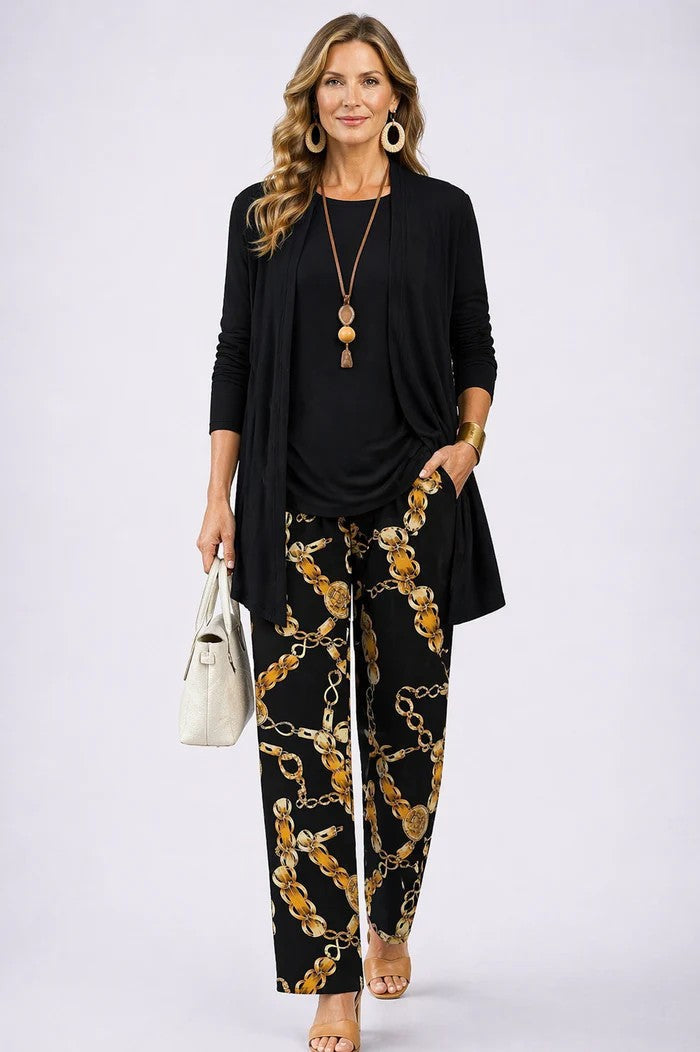 Woman walking in stylish printed three-piece set, highlighting relaxed fit, comfort & flow of the fabric.