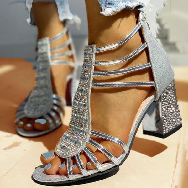 Sparkling rhinestone strappy block heel sandals, perfect glamorous footwear for evening wear.