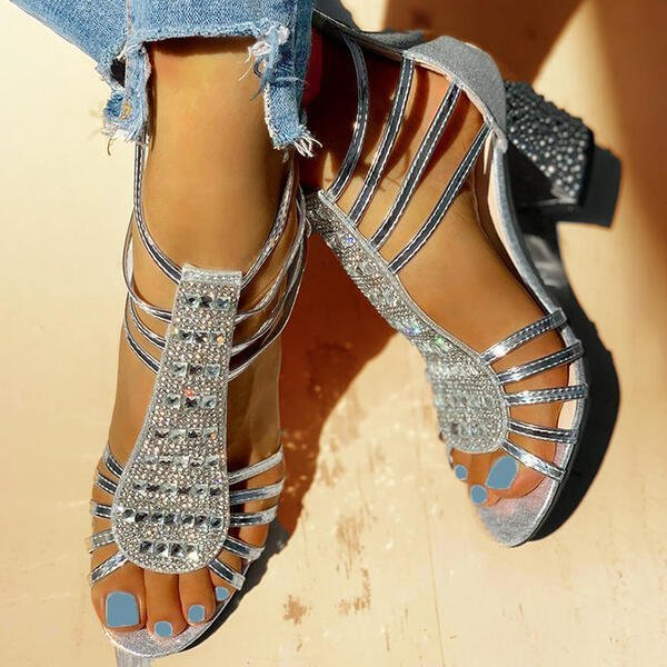 Women's comfortable and elegant gold strappy block heel sandals with dazzling rhinestone embellishments.