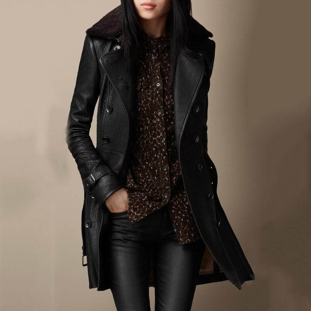 Timeless women's tailored trench coat. Chic black outerwear for an elegant, sophisticated and versatile style.