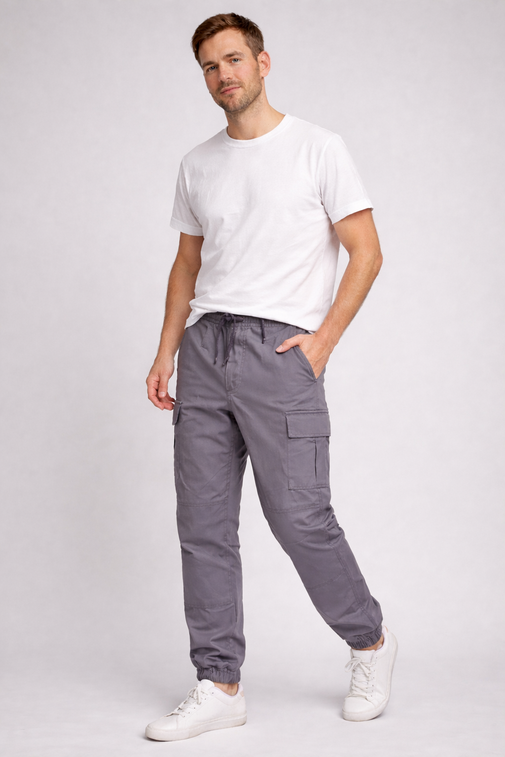 Modern fit men's utility cargo pants with multiple pockets, lightweight and trendy for urban casual and streetwear.