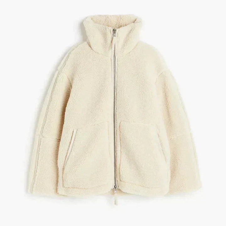 Women's cozy teddy fleece jacket with full zipper & stand-up collar. Warm, stylish outerwear for autumn.