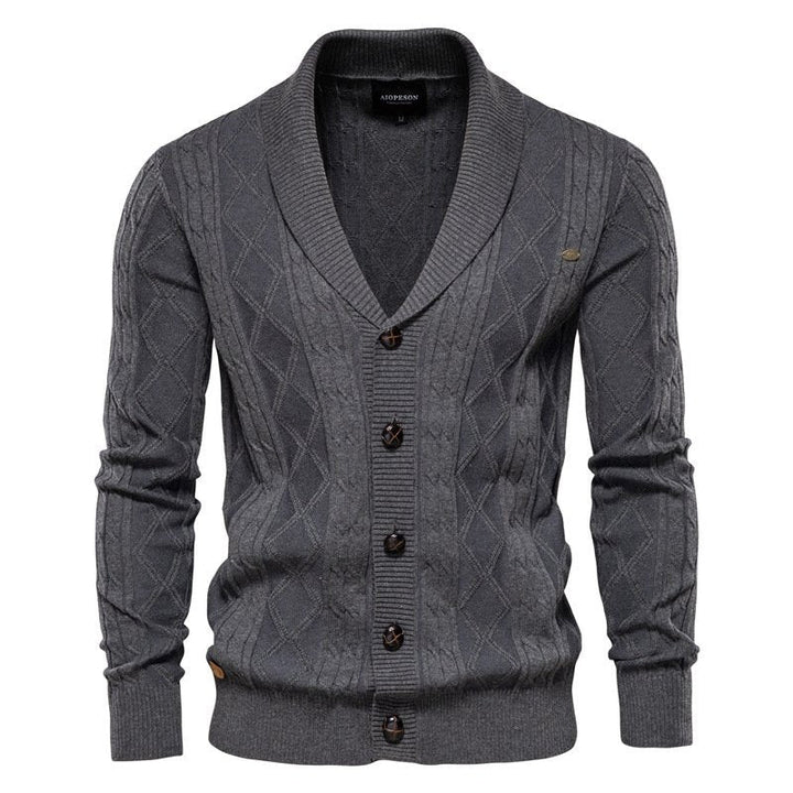 Textured men's cable knit cardigan, V-neck, and stylish shawl collar for smart casual wear.