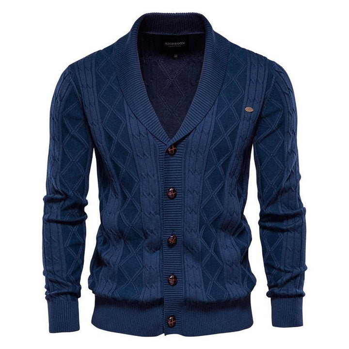 Intricate cable knit men's cardigan featuring a comfortable V-neck and elegant shawl collar; versatile knitwear.