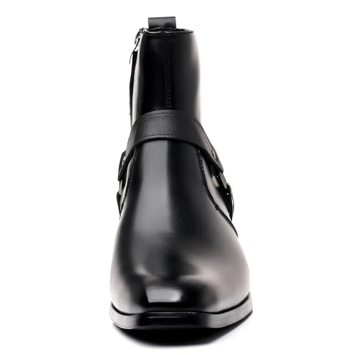 Men's black harness cowboy ankle boots. Features a distinctive western style with a sharp pointed toe.