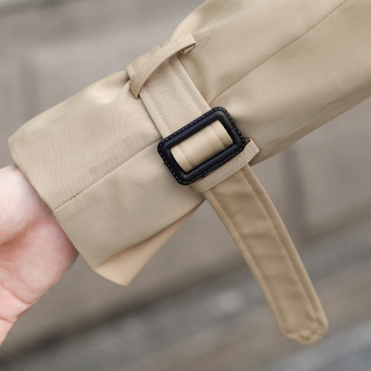 Sophisticated men's classic trench coat, double-breasted front & belt detail. Essential men's outerwear for cool weather.
