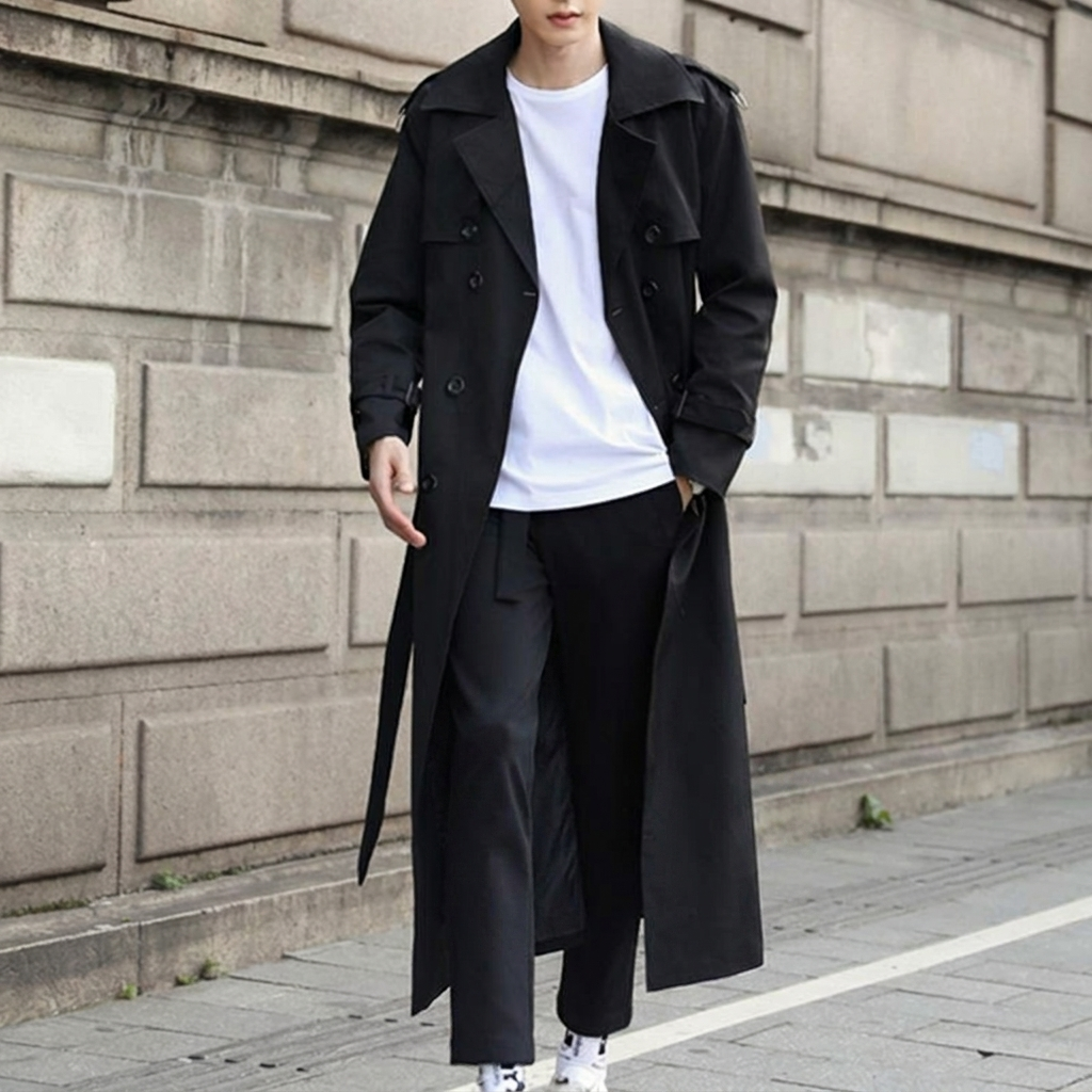 Men's fashion double-breasted trench coat with a belt. Long, classic style outerwear, ideal for autumn and winter.